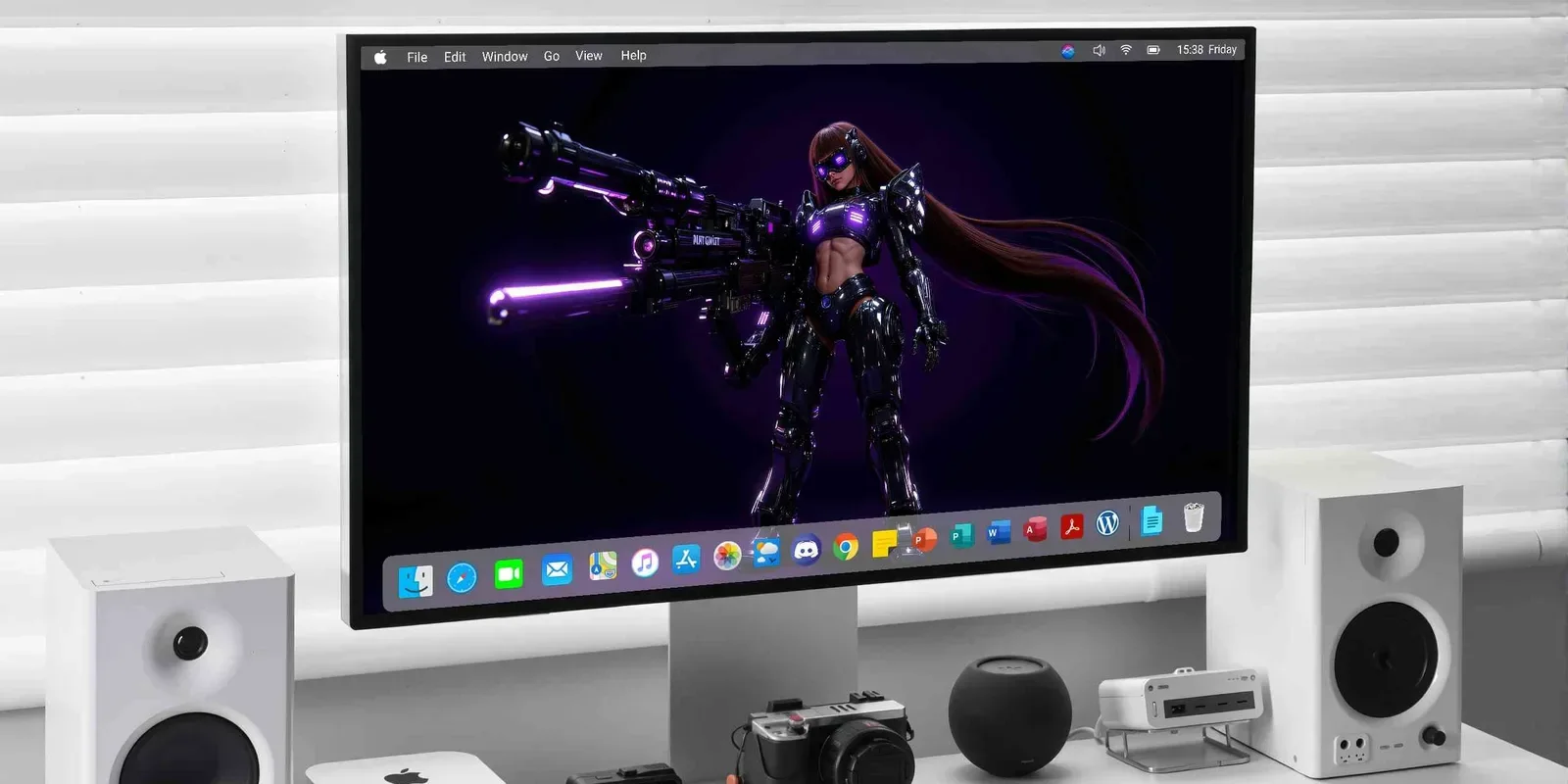 A desktop monitor shows a figure in black and purple armor holding an oversized rifle with purple lights, long brown hair trailing to the right.